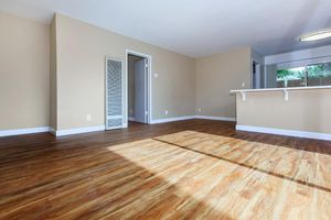 a large empty room with a hard wood floor