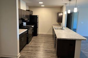 a kitchen with an island in the middle of a room