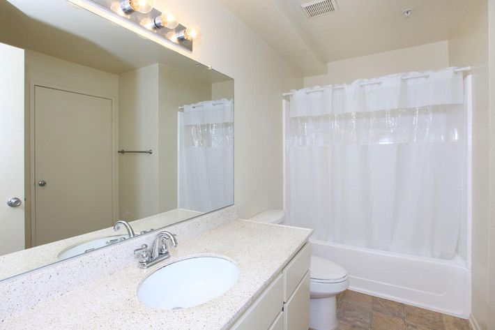 Bathroom with a white shower curtain