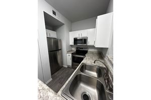 a stove top oven sitting inside of a room