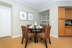 a room filled with furniture on top of a wooden floor