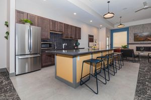 a kitchen with a table in a room