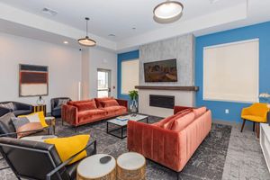 a living room filled with furniture and a flat screen tv