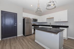 a kitchen with a large mirror