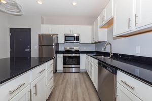 a large kitchen with stainless steel appliances