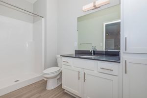 a kitchen with a sink and a refrigerator