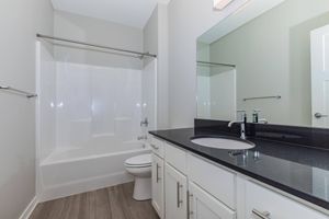 a kitchen with a sink and a mirror