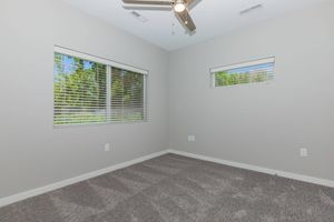 a bedroom with a large mirror