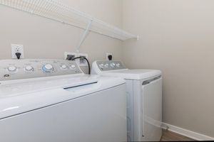 a kitchen with a sink and a refrigerator