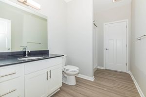 a kitchen with a sink and a mirror