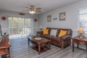 a living room filled with furniture and a table