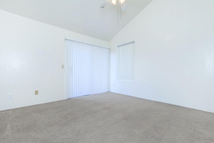 a bedroom with a bed in a room