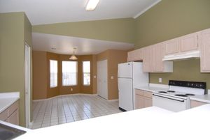 a kitchen with a sink and a refrigerator