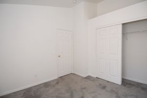 a white refrigerator freezer sitting inside of a building