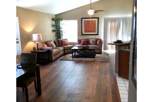 a view of a living room with a wooden floor