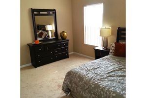 a bedroom with a bed in a room