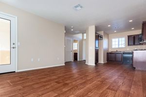 a large empty room with a wood floor