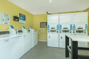 a kitchen with a stove and a refrigerator