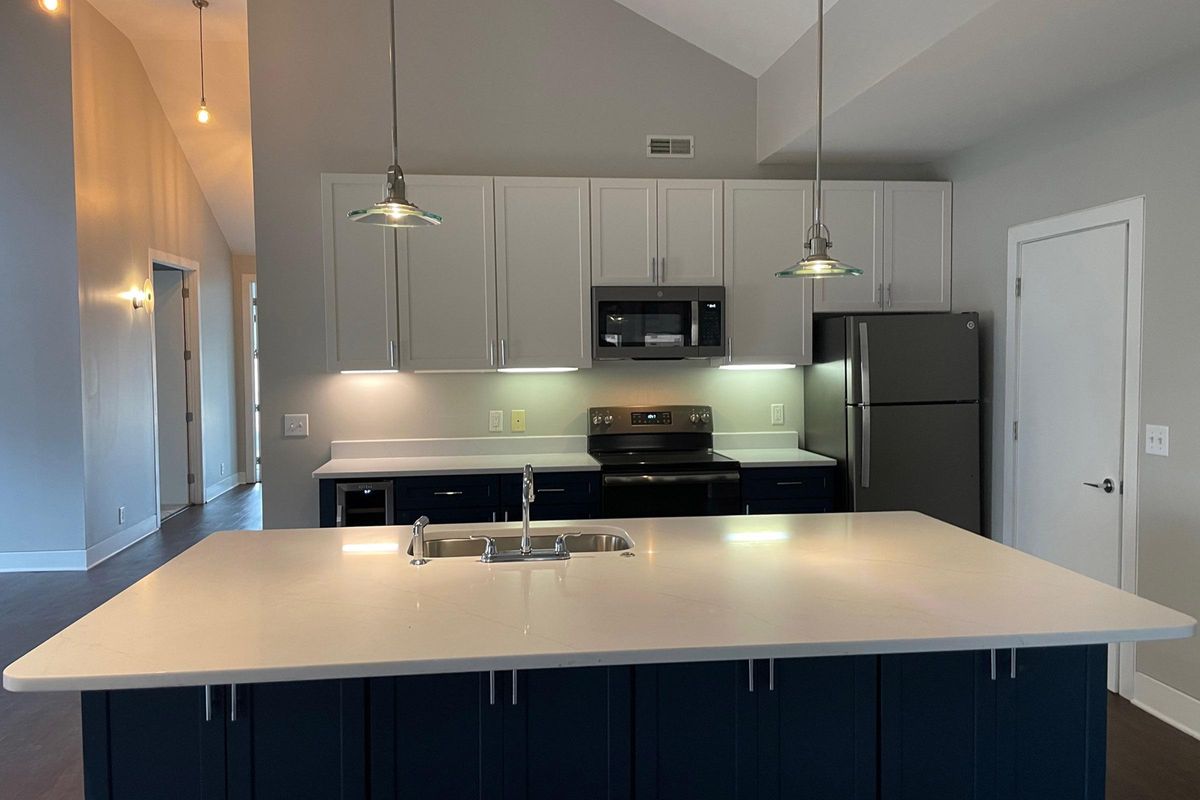 a modern kitchen with stainless steel appliances