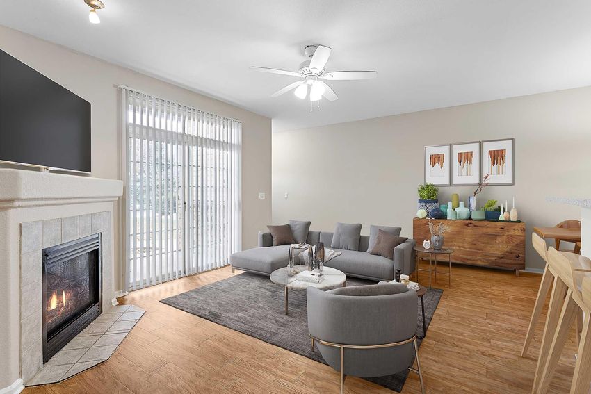 staged living room with furniture and a fireplace