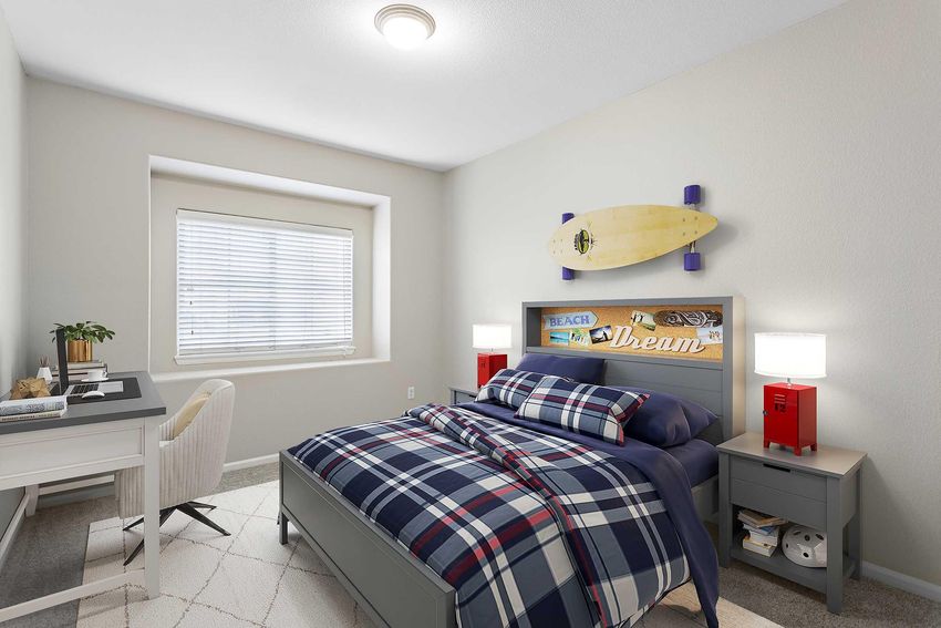staged bedroom with blue plaid blanket