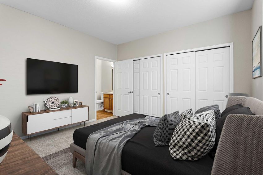 staged bedroom with sliding closet doors
