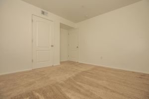 vacant carpeted bedroom