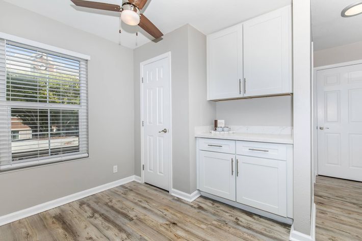 a kitchen with a sink and a window