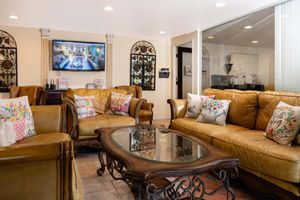 a living room filled with furniture and a fireplace