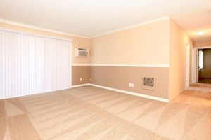 Vacant living room with AC unit