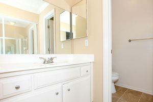 Bathroom sink with white cabinets