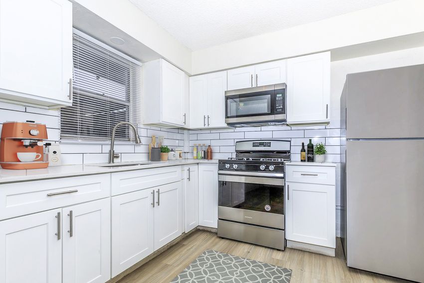 Apartment kitchen — representative home at Summit on Thomas.