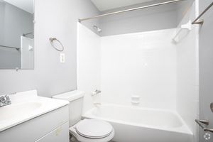 a shower that has a sink and a mirror