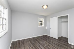 a large empty room with a wooden floor