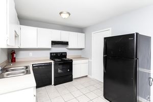 a stainless steel refrigerator in a kitchen