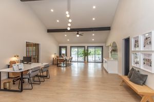 a living room filled with furniture and a wood floor