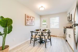 Kitchen dining table set and patio door with mini blinds included at The Arbor in Blue Springs, MO