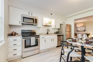 Platinum kitchen interior with white oak cabinets at The Arbor in Blue Springs, MO