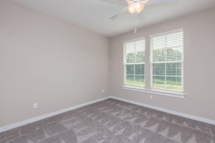 a living room next to a window