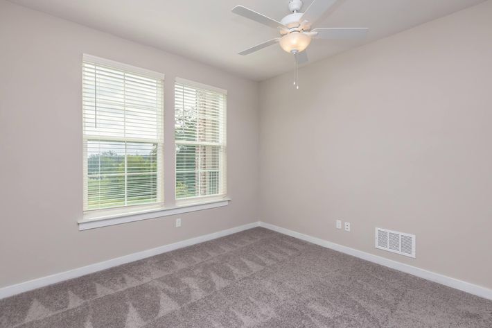 a bedroom with a large window