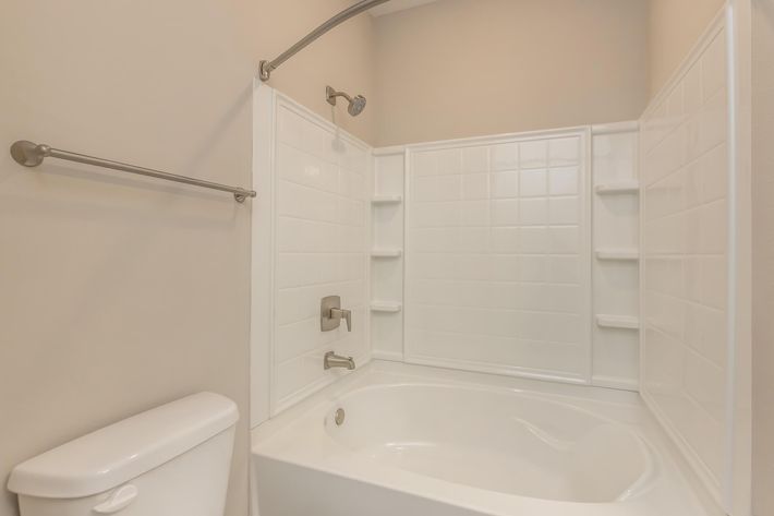 a close up of a sink and a bath tub