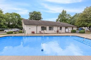 a house with a large pool of water