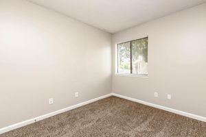 a bedroom with a large mirror