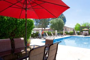 an open umbrella near a pool of water