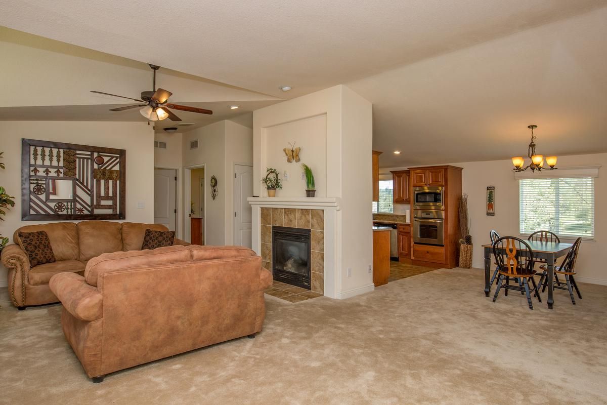 a living room filled with furniture and a fireplace