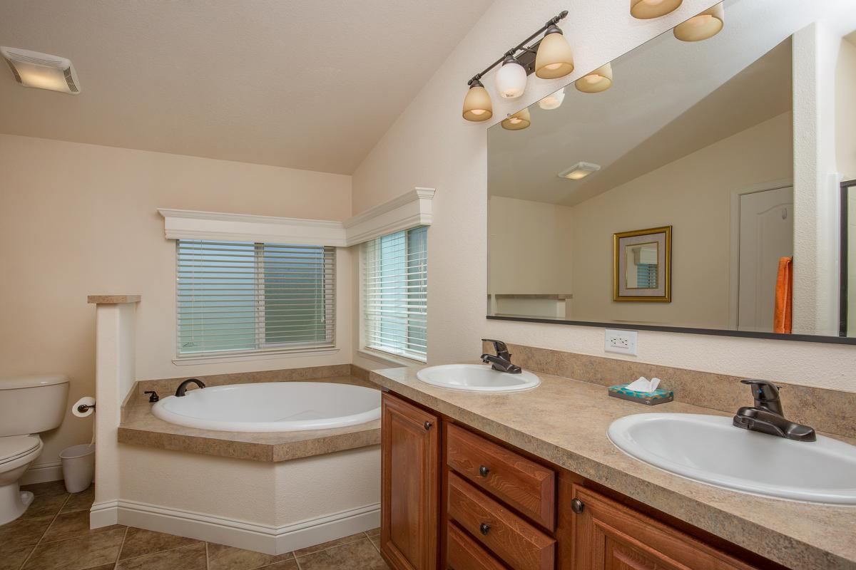 a kitchen with a sink and a mirror