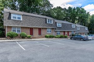 a parking lot in front of a house