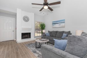 a living room filled with furniture and a fireplace