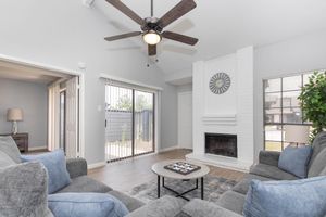 a living room filled with furniture and a large window