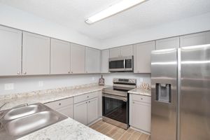 a stainless steel refrigerator in a kitchen